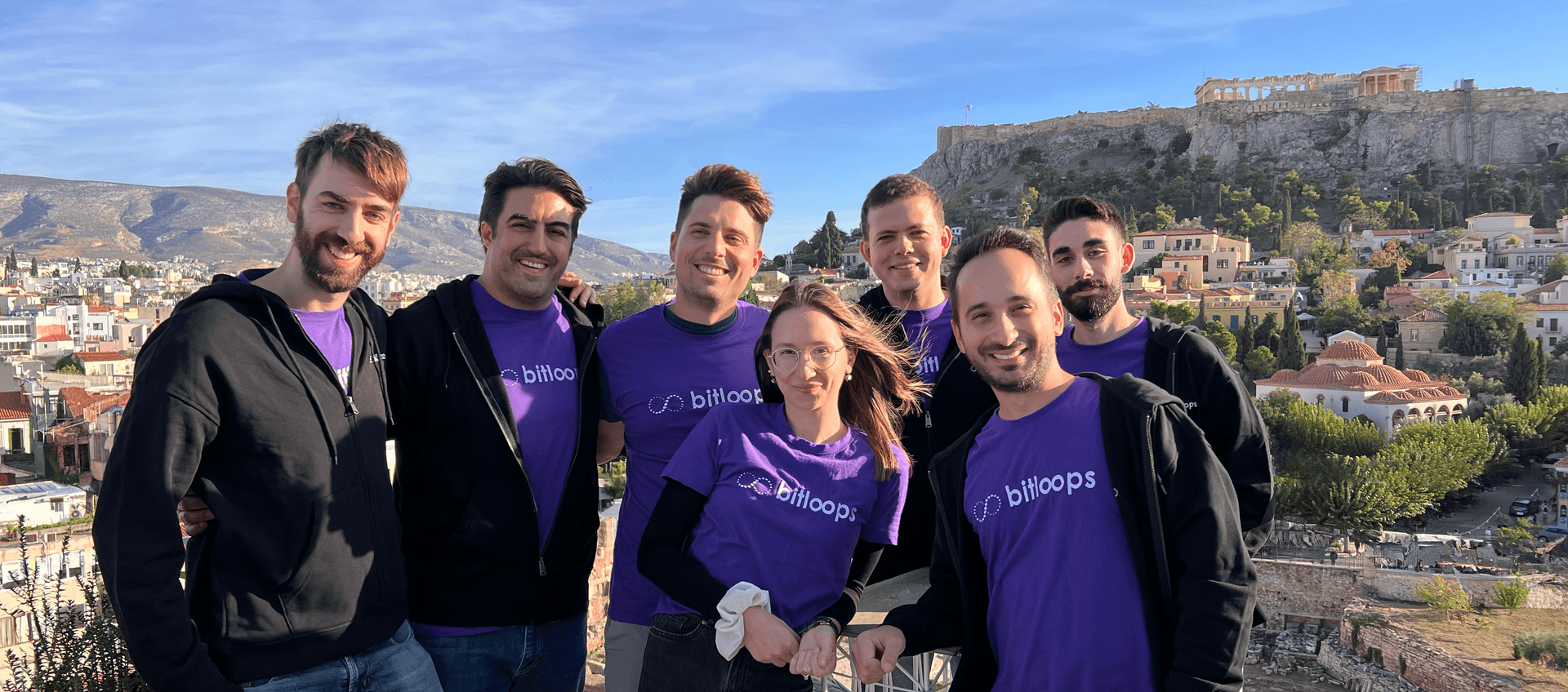 Bitloops team with Acropolis background